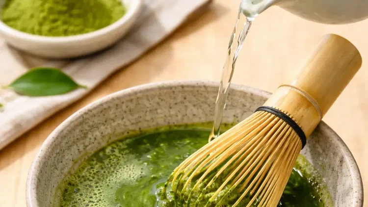 Image of Add 2 teaspoons of matcha powder to a bowl. Pour...