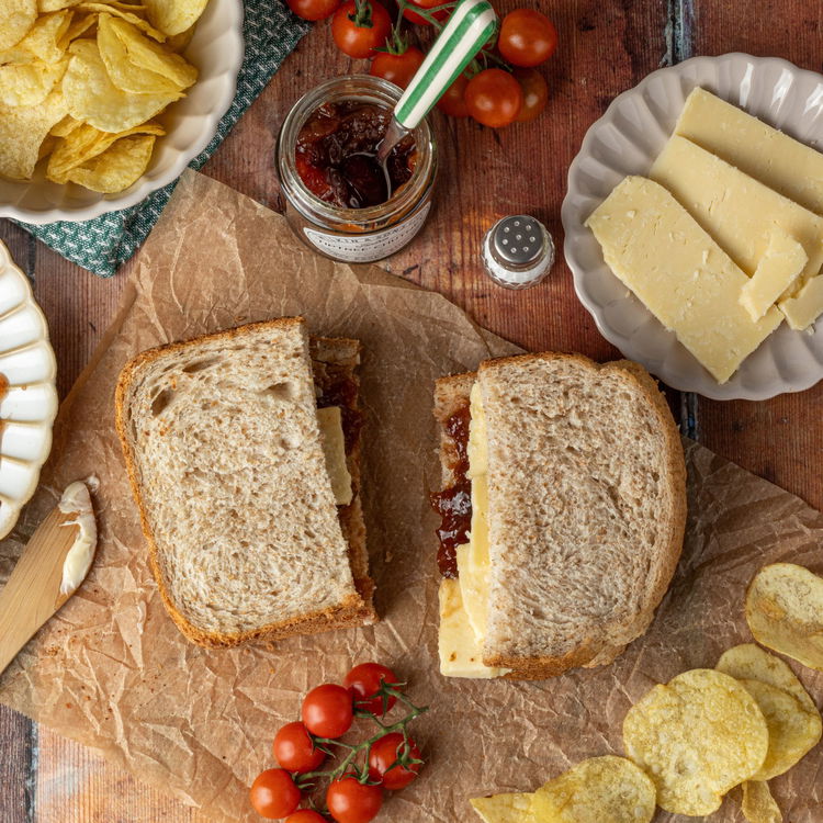 Image of Lightly press down and cut the sandwich in
half. 