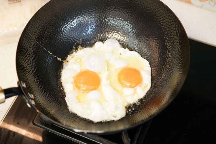 Image of Turn the heat to high and heat your wok until...