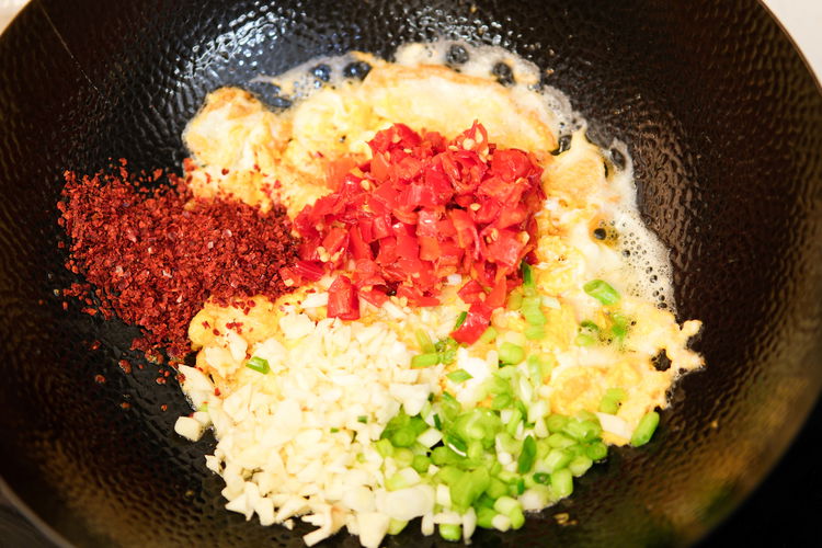 Image of Add 2 tbsp of minced garlic, the diced white parts...