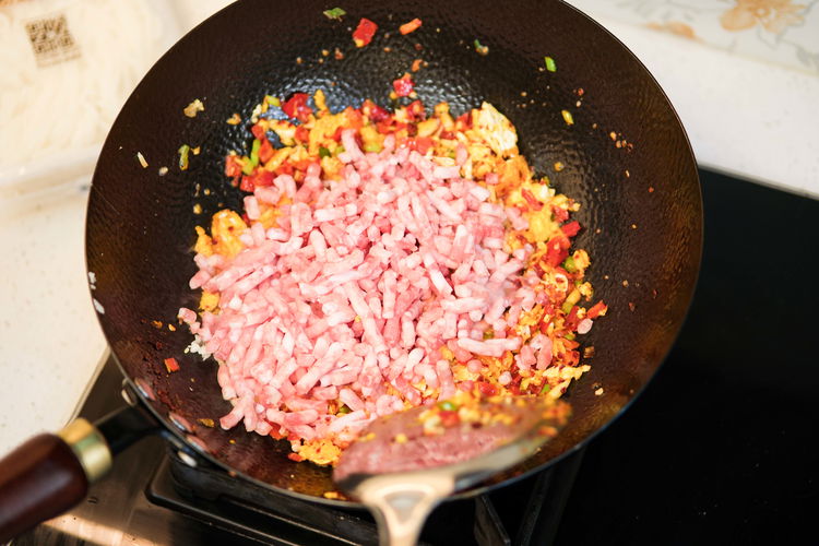 Image of Add the ground pork and continue to stir until the...