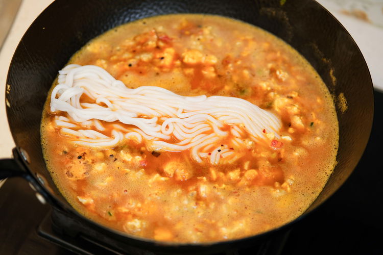 Image of Season the noodle soup with salt and soy sauce. Keep...