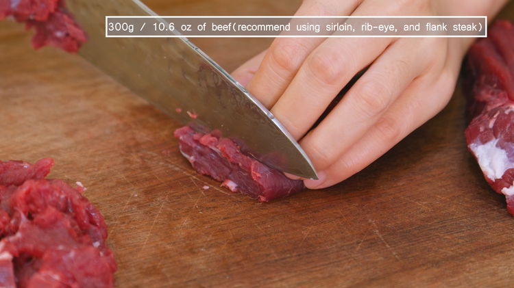 Image of Slice the beef into thin strips, then thinly slice the...