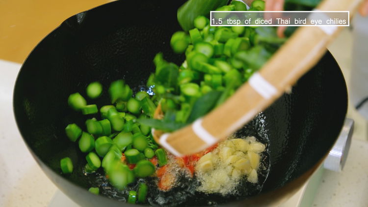 Image of Turn the heat to high and heat the wok until...