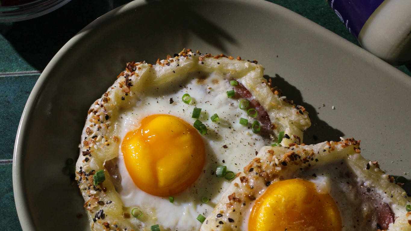 Close-up of flaky puff pastry brushed with melted beef tallow and topped with everything bagel seasoning