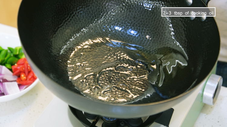 Image of Turn the heat to high and heat your wok until...