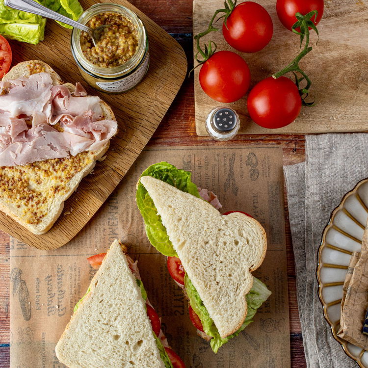 Image of Lightly press down and cut the sandwich in half.