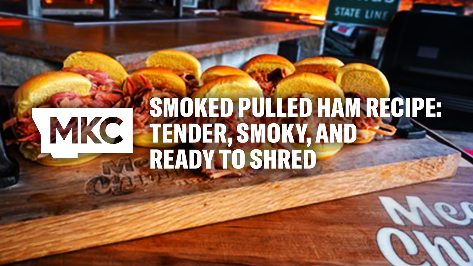 Several smoked pulled ham sandwiches arranged on a wooden cutting board for a smoked pulled ham recipe.