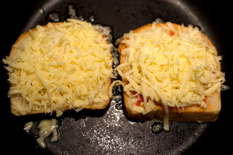 Image of Add greated cheese into each slice. It is about ½...