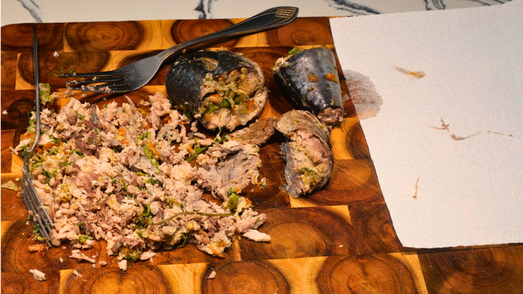 Image of Shred the cooked mackerel with a fork and remove any...