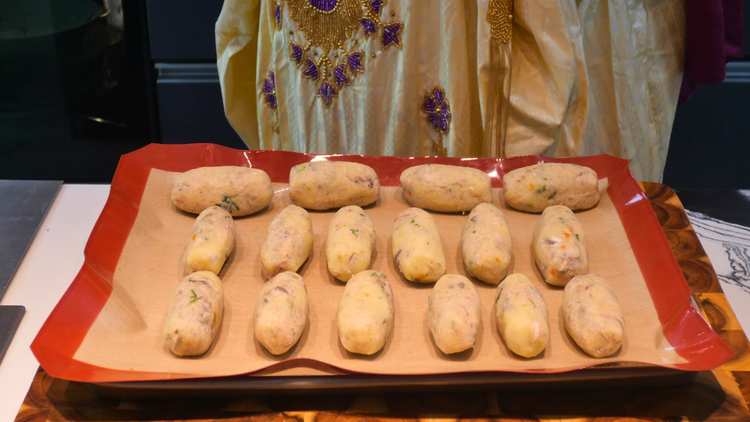 Image of Grab a portion of the potato mixture and shape into...