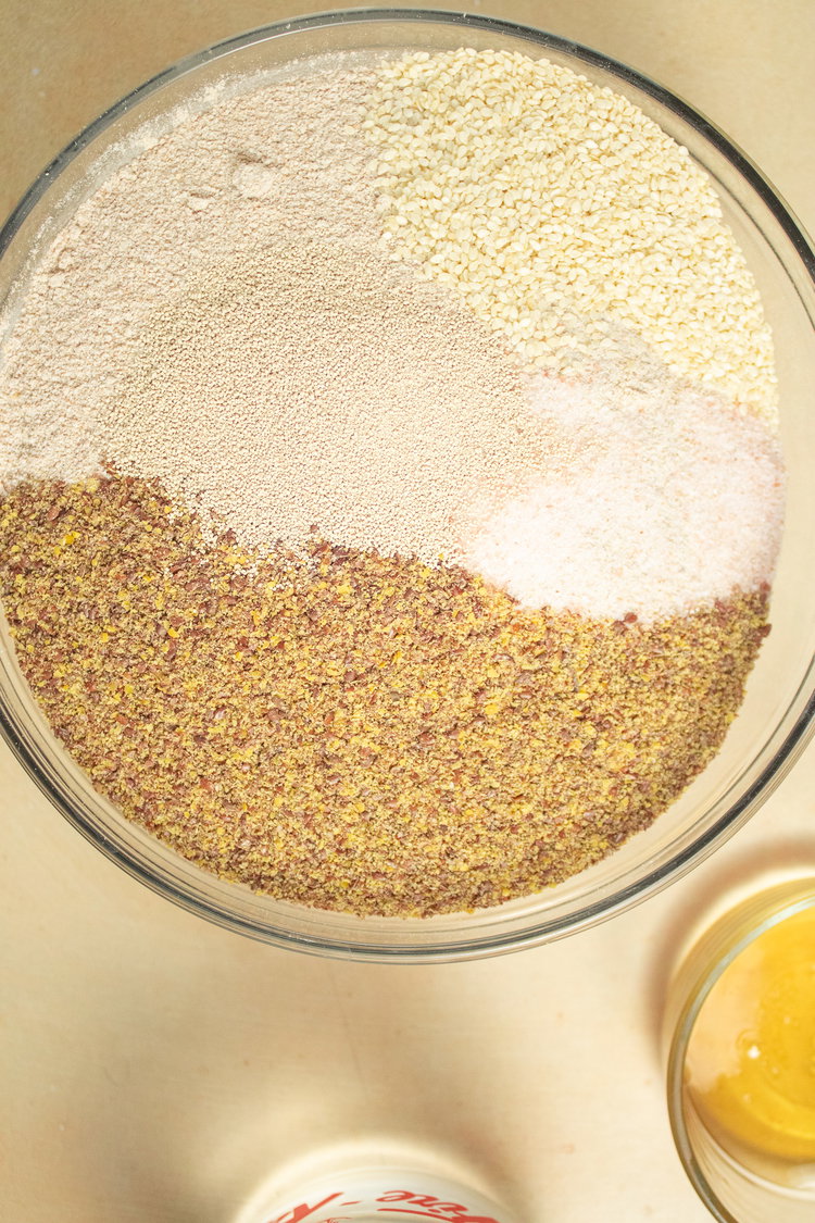 Image of Mix together spelt flour, flax, sesame seeds, yeast and salt.