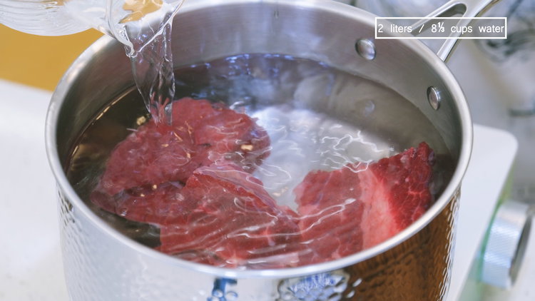 Image of Cut the beef into large chunks and place in a...