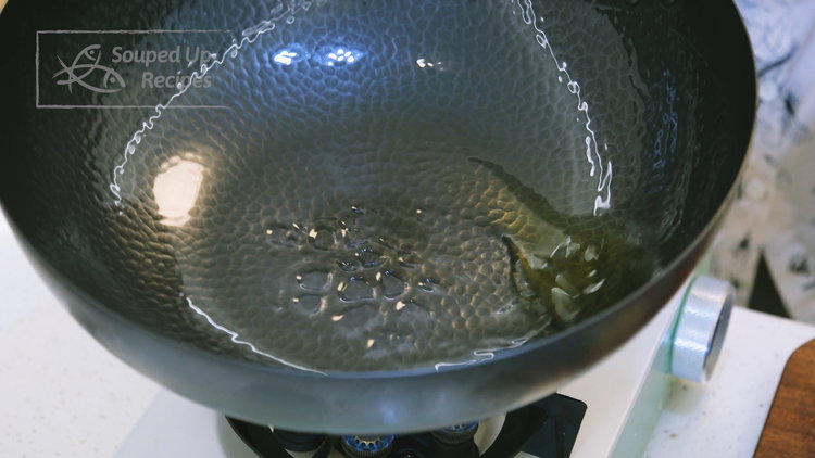 Image of Turn the heat to high and heat the wok until...