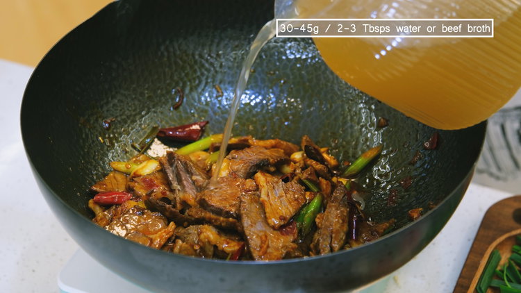 Image of Add the cooked beef along with 2–3 tablespoons of water...