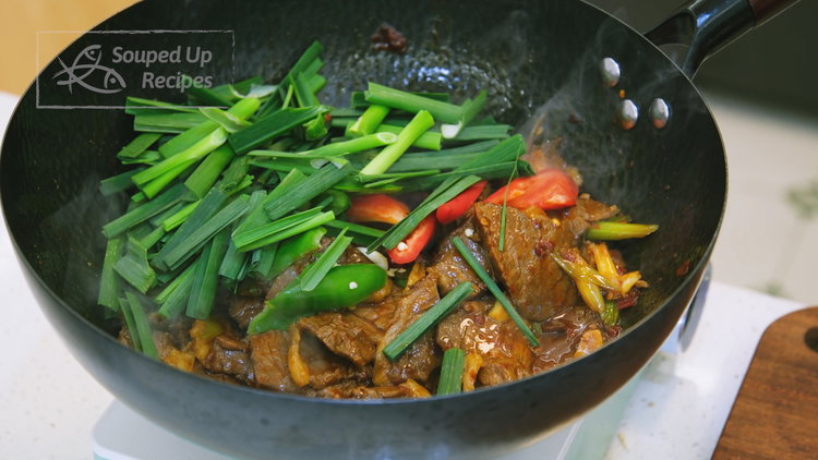Image of Add the green and red chilies and the green parts...