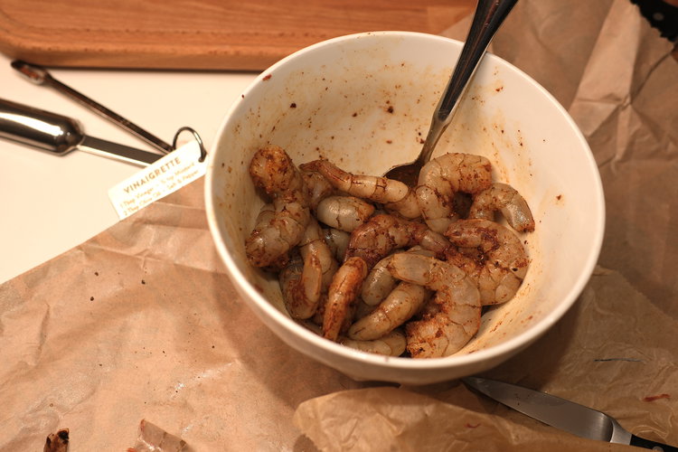 Image of Add salt, pepper, and paprika to the shrimp in a...