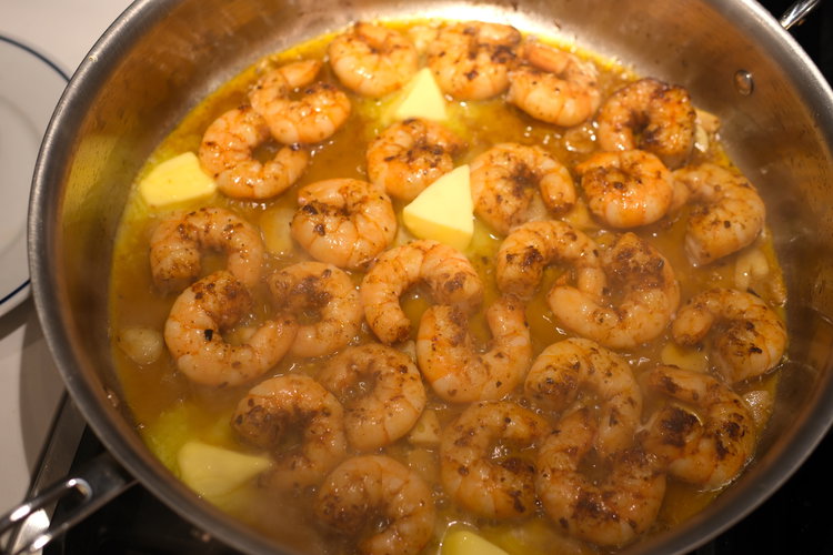 Image of Add the cold butter, spreading it around the pan.
