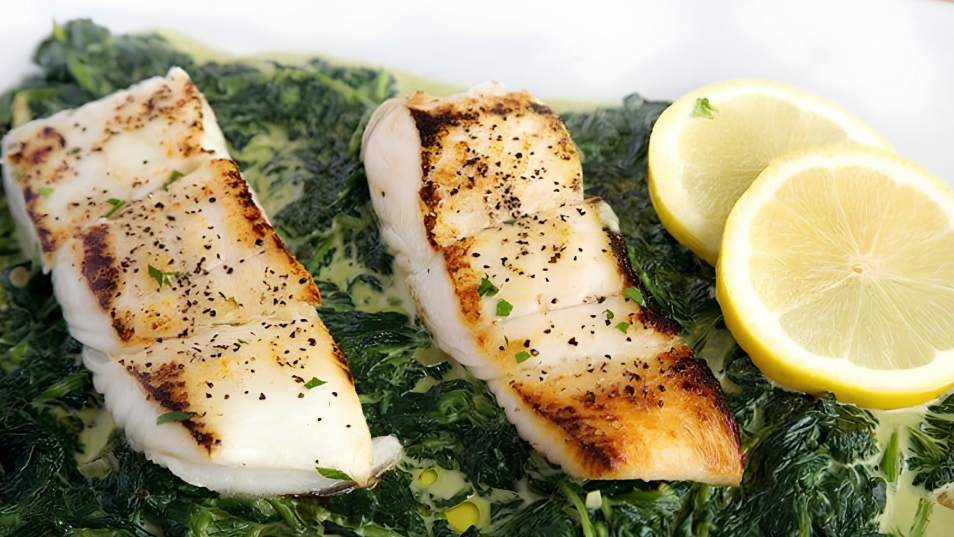 Image of Pan Seared Halibut Over Creamed Spinach