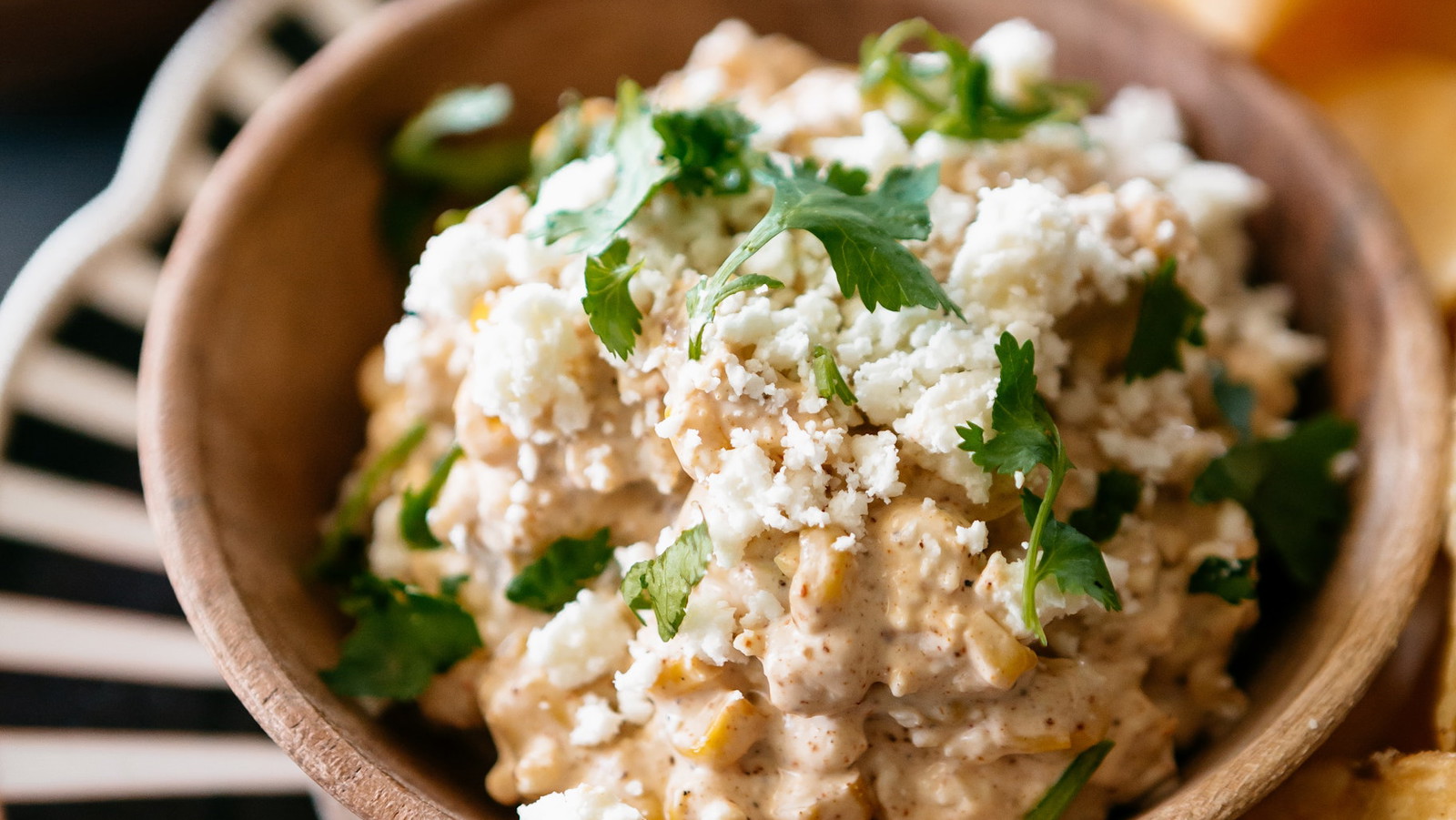 This zesty, elote-inspired dip features charred corn and salty cotija cheese in a creamy lime-infused base, paired perfectly with Vandy Original.