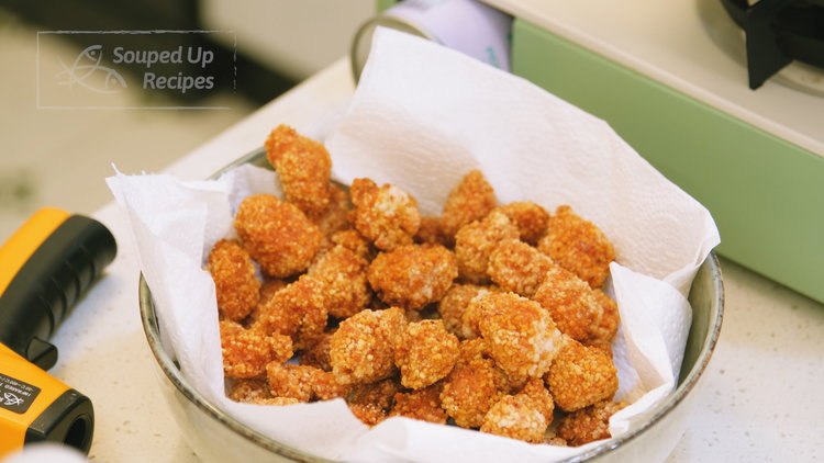 Image of Remove the chicken and drain on paper towels. Between batches,...