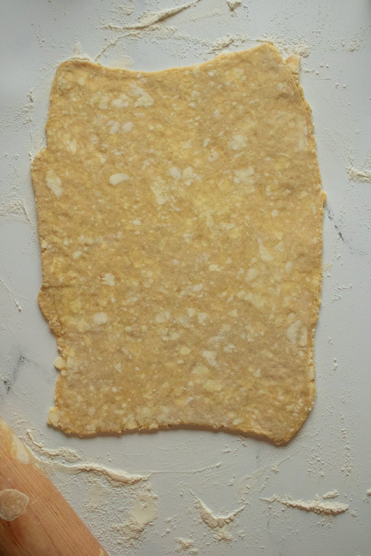Image of Flour the surface and roll out the dough into a...