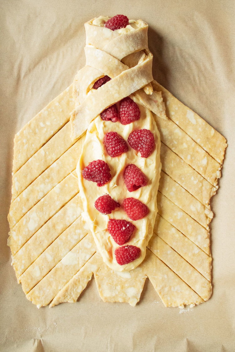 Image of Line a baking pan sheet with parchment. Divide the dough...
