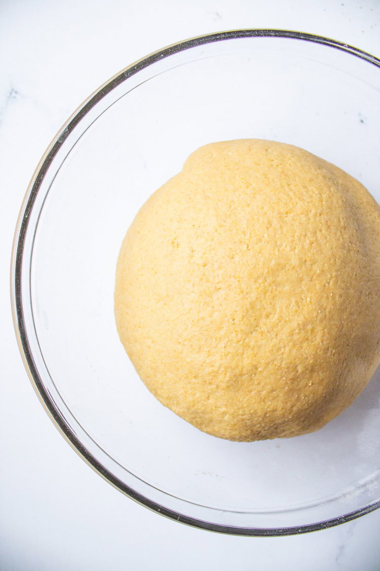 Image of Knead on a lightly floured surface. Place in a greased...