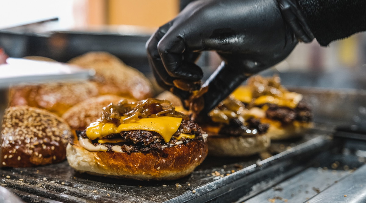 Garlicky Smash Burgers with Roasted Garlic Aioli and Caramelized Onions