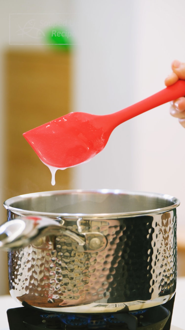 Image of In a small saucepan, whisk together the water and glutinous...