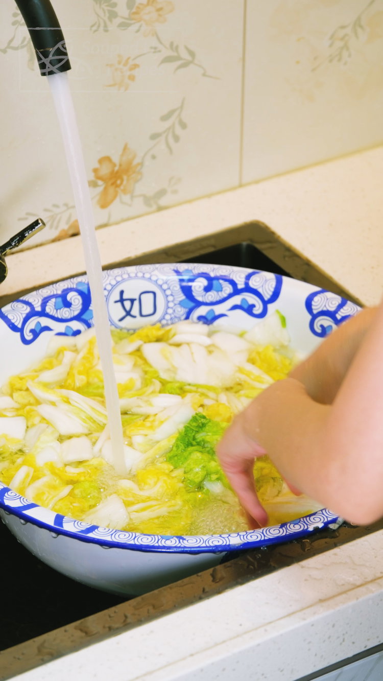 Image of Rinse the salted cabbage 2-3 times under cold water to...