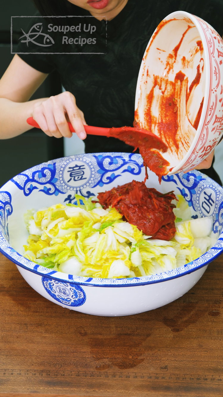 Image of Add the squeezed cabbage to the seasoning mixture and toss...