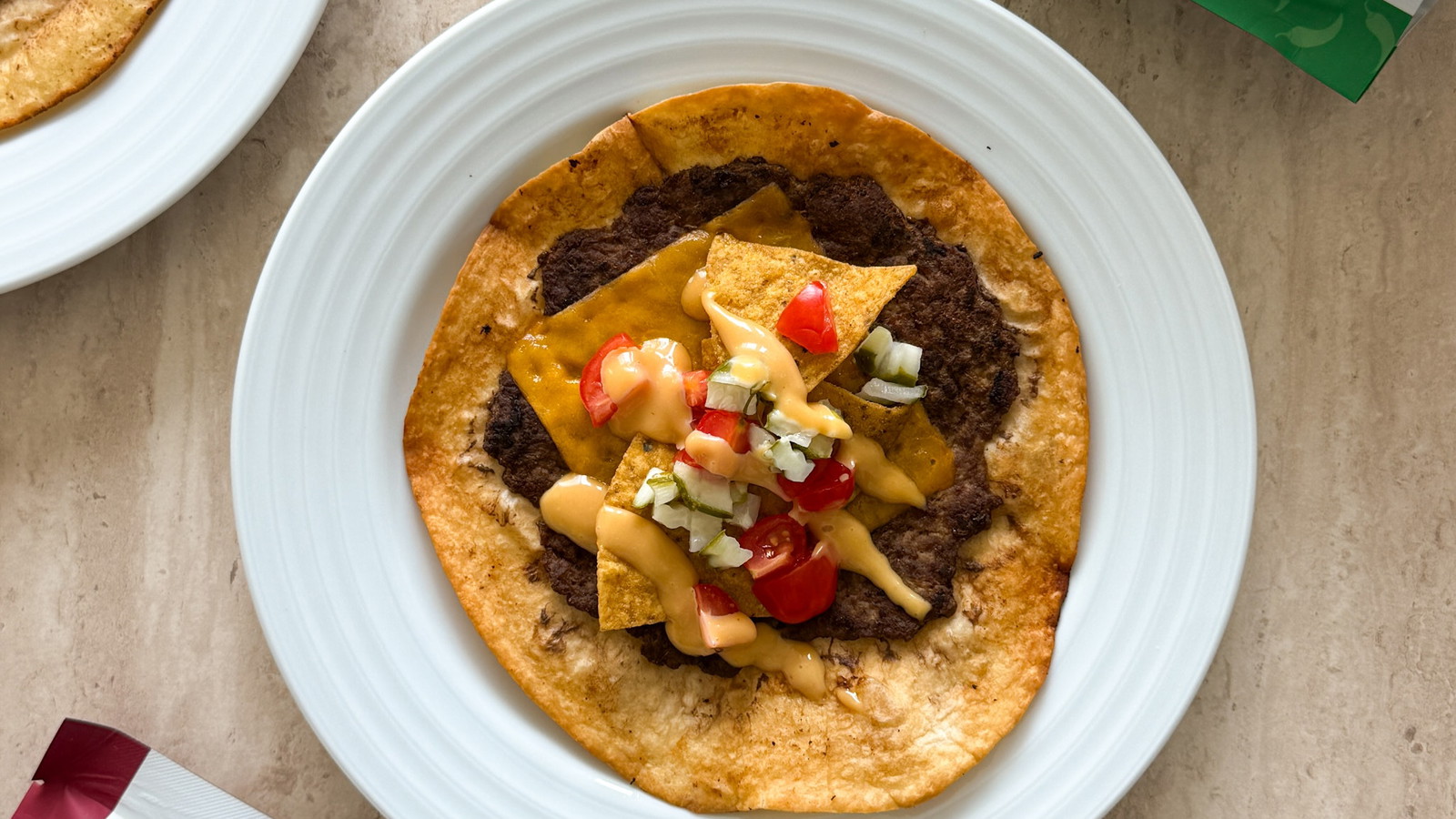 Juicy seasoned beef smashed on a tortilla, melted cheese, and a crunchy layer of spicy MASA Chips.
