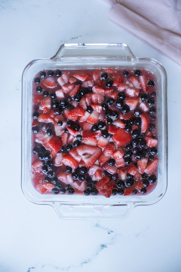 Image of Add in fruit and stir to coat with the liquid....