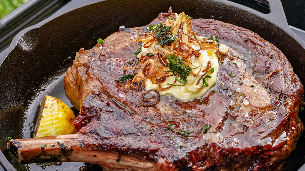 Cast Iron Crusted Gold Cowboy Steak with Crispy Shallot and Garlic Herb Butter