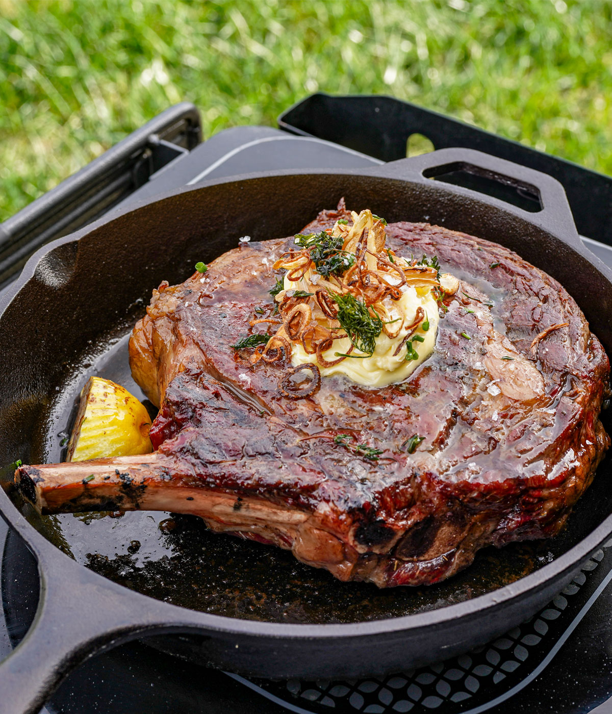 Cast Iron Crusted Gold Cowboy Steak with Crispy Shallot and Garlic Herb Butter