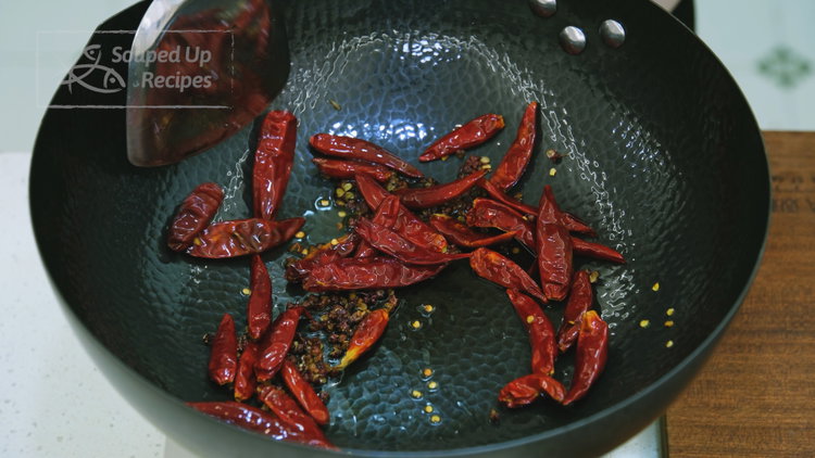 Image of To make the Dao Kou La Jiao, add oil and...