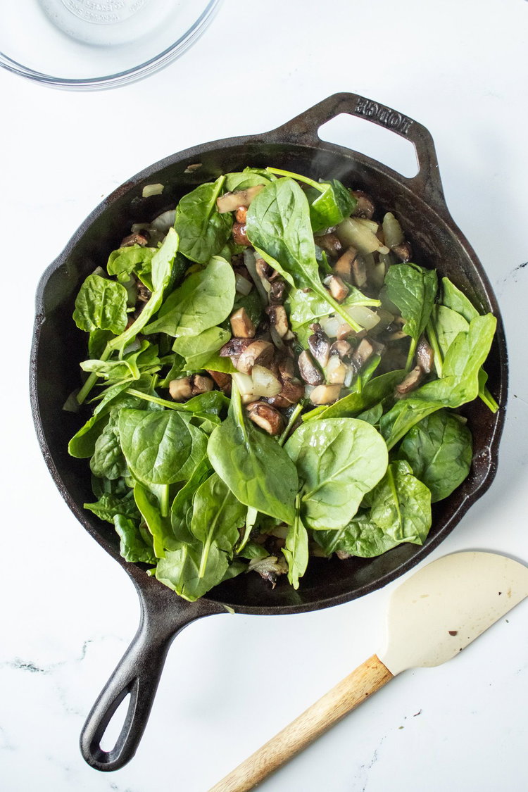 Image of Add in herbs and spinach. 