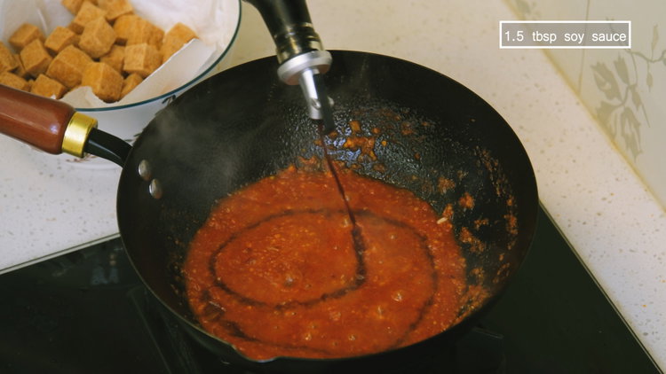 Image of Pour in the tomato puree; add salt and soy sauce...