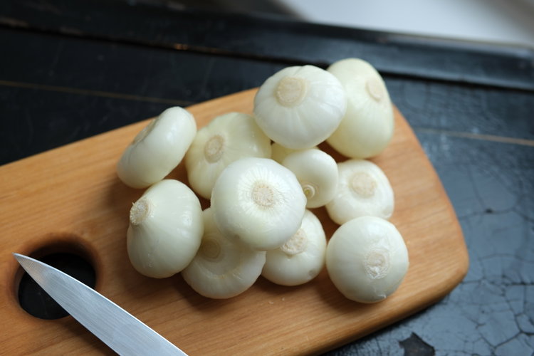 Image of Peel and trim the onions