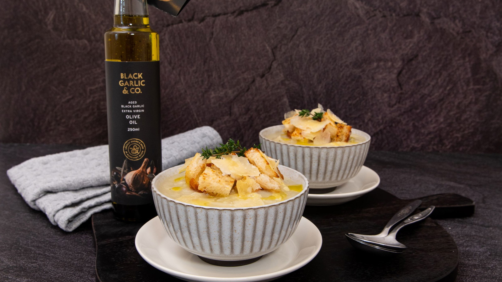 Image of Creamy Cauliflower Soup with Infused Black Garlic Olive Oil