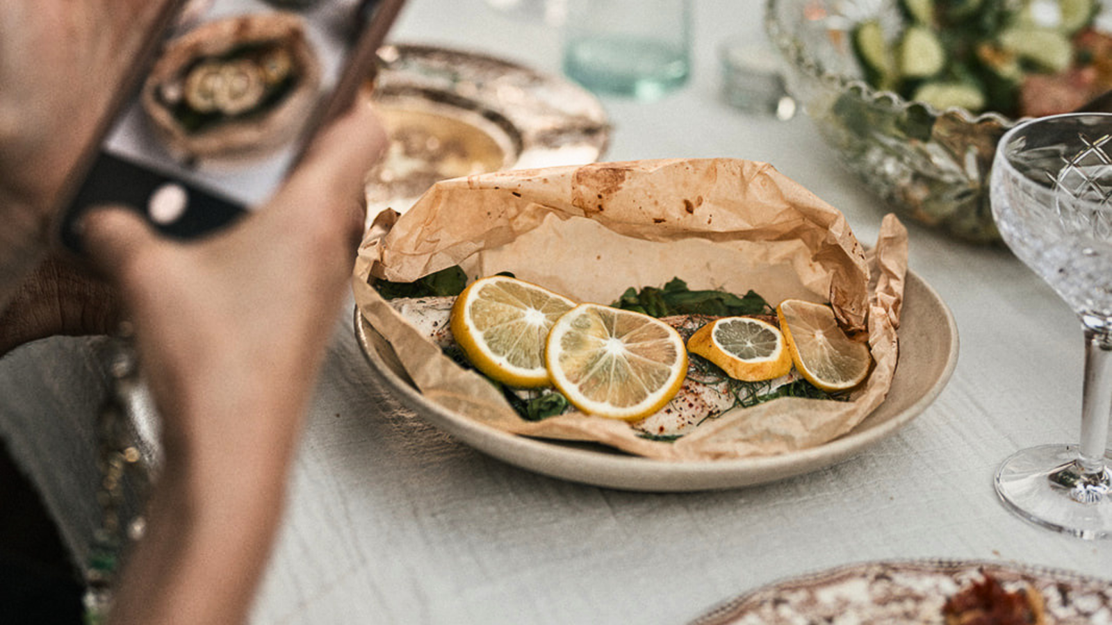 Image of Sea Bass en Papillote with Spinach, Asparagus, Lemon, and Herbs