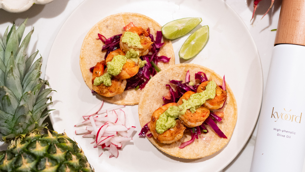 Image of Smoky Shrimp Tacos with Vegan Avocado Crema and Tropical Slaw