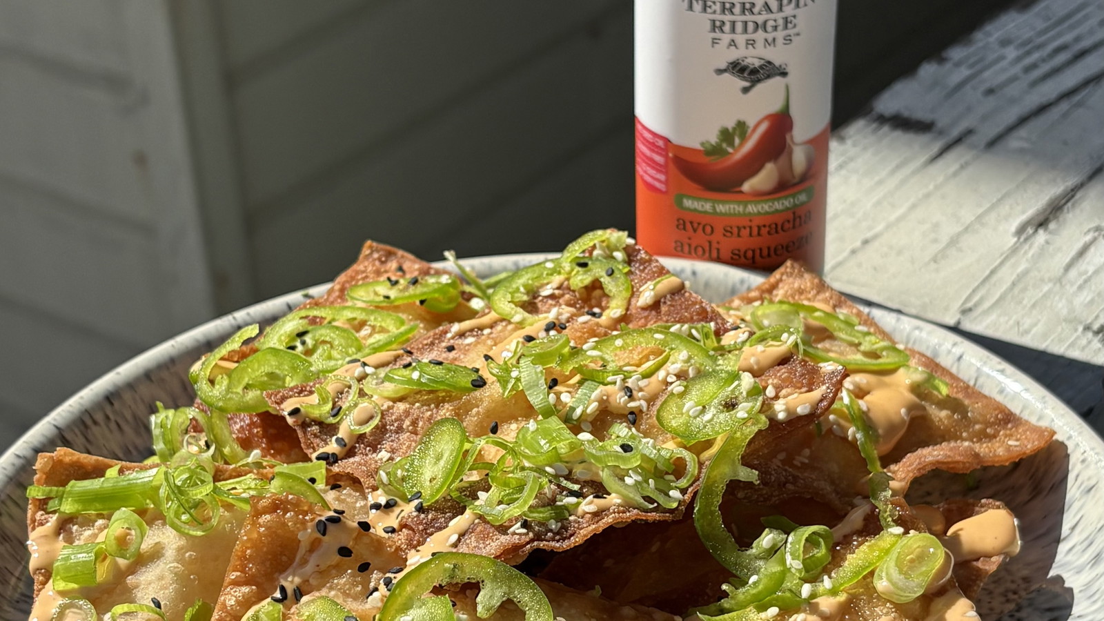 Image of Crab Rangoon Nachos with Avo Sriracha Aioli