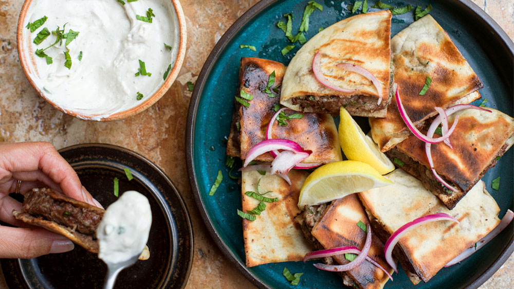 Grilled Ground Beef Arayes with Tahini Yogurt Sauce & Sumac Pickled Onions