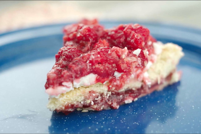 A slice of a raspberry white chocolate bar dish.