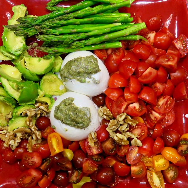 Image of burrata with pesto and veggies