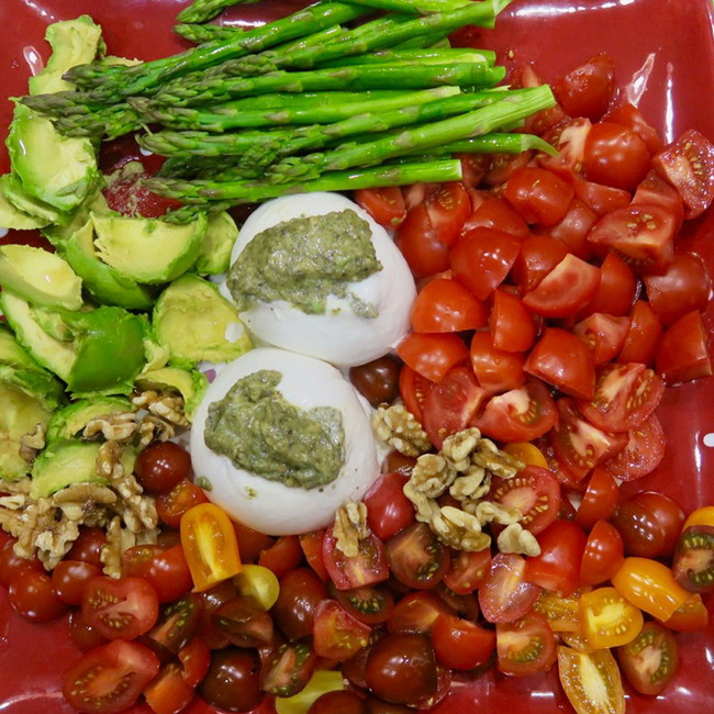 Image of burrata with pesto and veggies