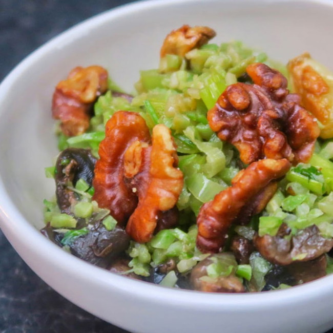 Image of shaved broccoli with toasted walnuts and garlic