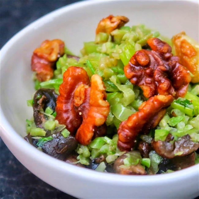 Image of shaved broccoli with toasted walnuts and garlic